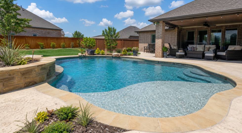 Family backyard pool with tanning ledge and covered patio